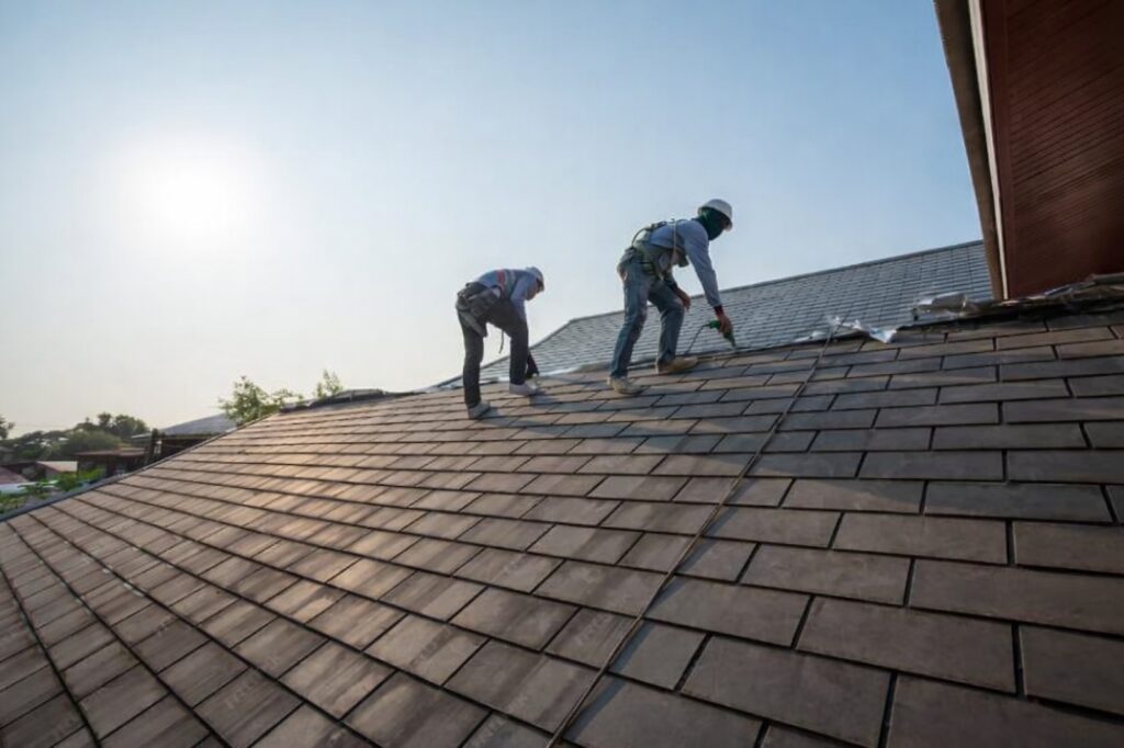 Deerfield Beach roof repair contractors installing roof shingles on residential home in South Florida